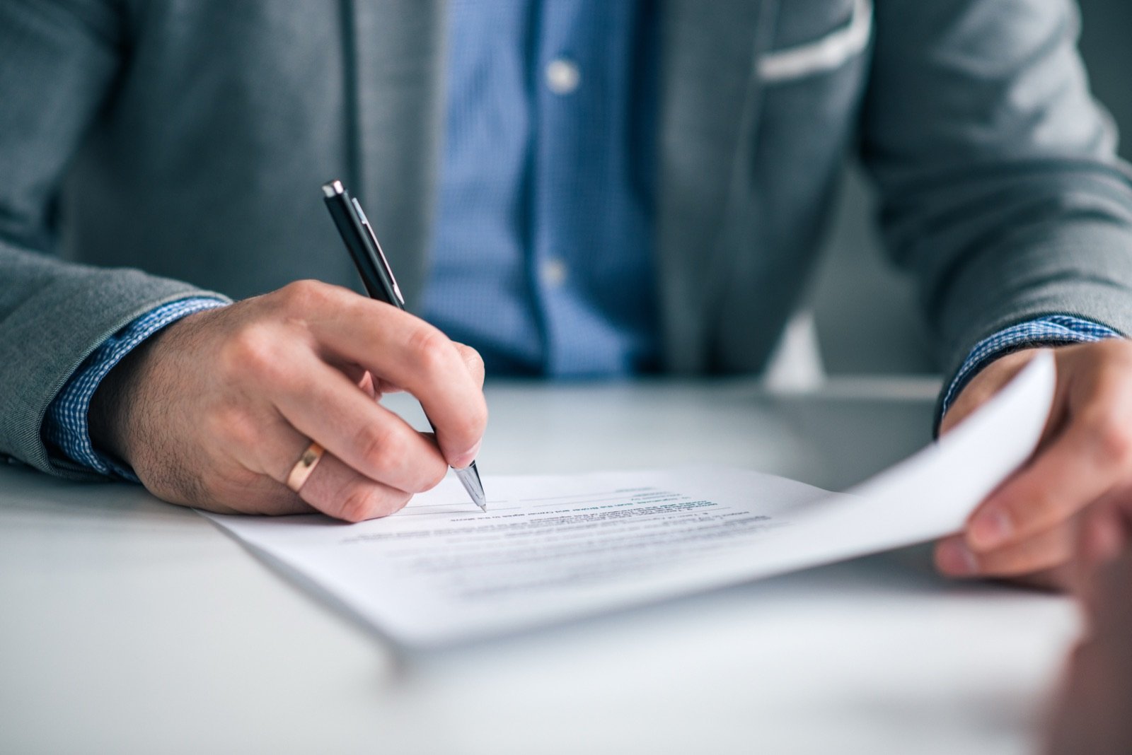 Facility manager signing a courier service level agreement